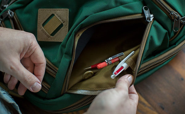 Pens slotted into the internal pen slots in the left side pocket of the Guide's Edition Synik 22.